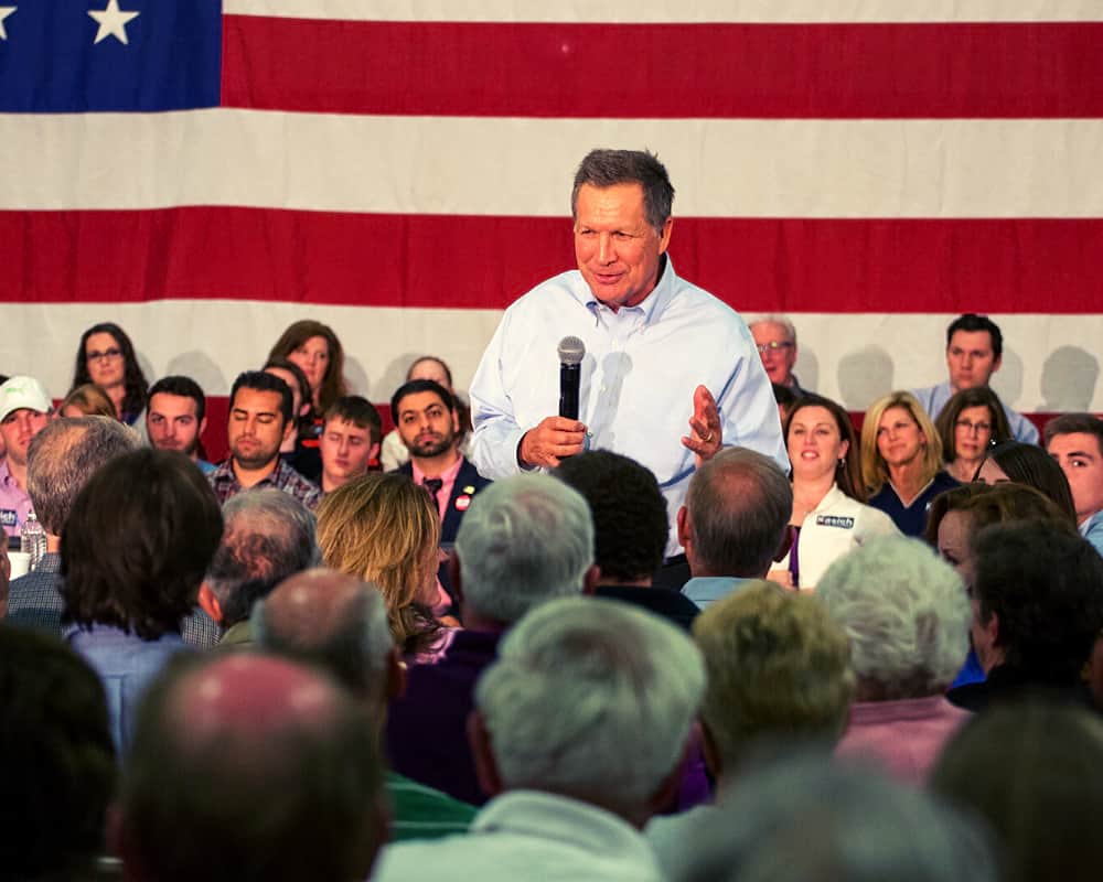 John Kasich having a talk in public | Kasich Needs To Be Forced Out Of The Race | featured | presidiential campaign