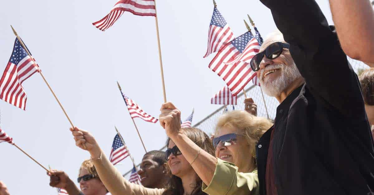 People Waving US Flag