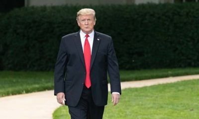 Donal Trump in suit walking featured | New Moody’s Analytics Model Predicts Easy Win for Trump in 2020 | featured