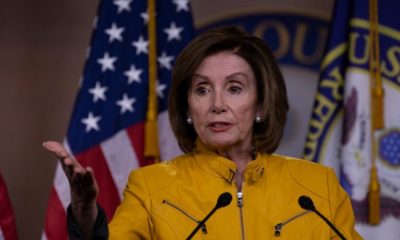 Pelosi in yellow | Pelosi Sets Medicare Showdown on Drug Costs | Featured