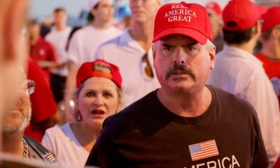 Trump supporters wearing Keep America Great cap | Divisions on Impeachment Reflect Deep American Political Divide | Featured