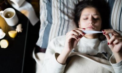 Woman checking her temperature | WORRIED SICK: Countering the Common Cold | Featured