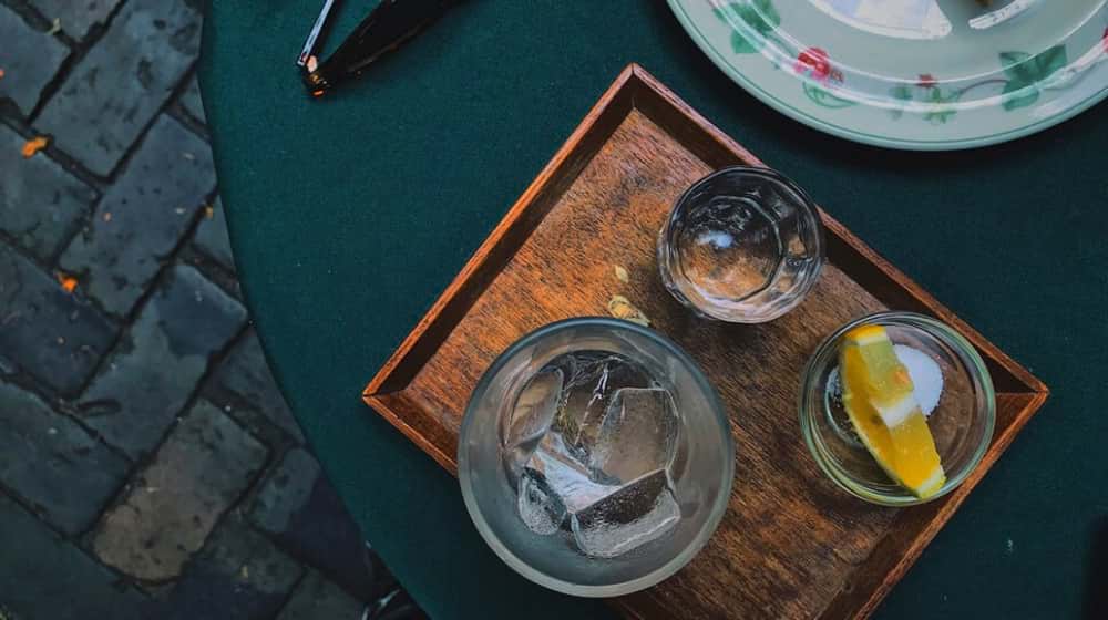 tequila on table with sunglasses | Let's Talk Tequila: What You Didn't Know 