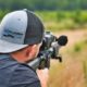 shallow focus photo of man holding a rifle | Grant County to Become Second Amendment Sanctuary | Featured