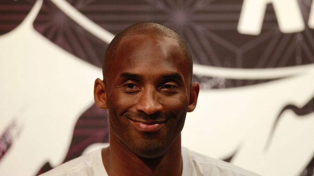 Kobe Bryant smiling | Politicians Set Aside Political Differences and Mourn Over Kobe Bryant’s Death | Featured