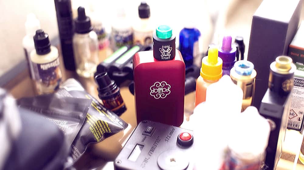 new electro box from dotmod along with a bunch of eliquids | Youth Vaping: Dangers All Parents Should Know