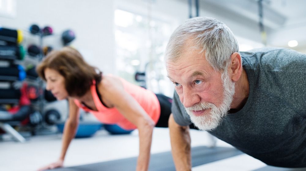 senior doing push ups exercise | STUDY: Morning Exercise Can Increase Weight Loss | Featured