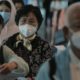 tourist in Wuhan wearing face mask | WHO: Coronavirus Declared Global Health Emergency | Featured