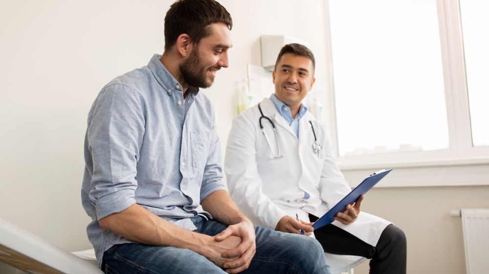 patient daily checkup with his doctor | Important Health Screenings Men Should Discuss with their Physicians | Featured