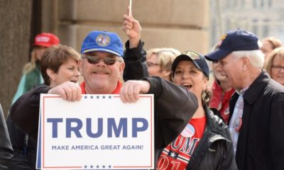 Makes it American Great Again banner with supporter | Trump Supporters Camp Out Ahead of Rally in Colorado Springs | Featured