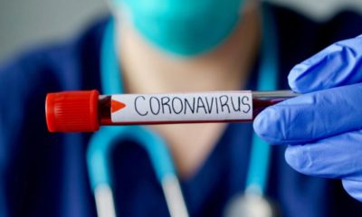 Nurse holding a blood test result of corona virus patient | Coronavirus Poses Threat to U.S. Economy | Featured
