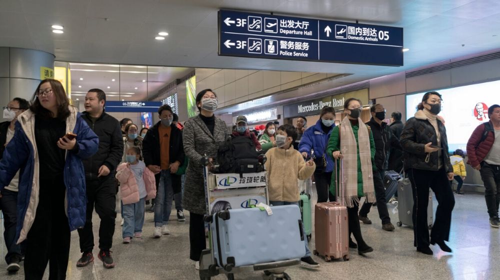 Travellers at the airport wearing face mask | Coronavirus Cases Outside of China Rise to 92 | Featured