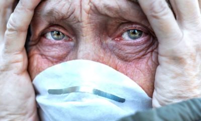 old woman wearing a face mask | Newly Engaged North Carolina Woman Shares Good News to Her Grandfather Through Window Amid Coronavirus Pandemic | Featured