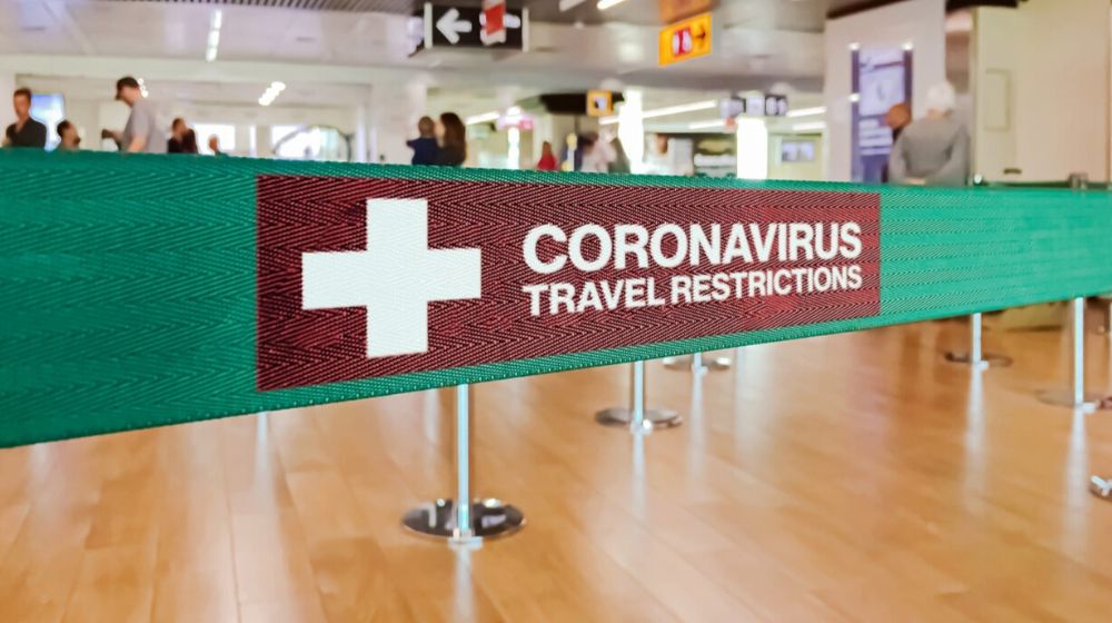 green ribbon barrier inside the airport | Travel Restricted, NBA Season Suspended as Coronavirus Fear Deepens | Featured