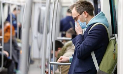 Sick man with face mask riding a train | Democrats Plan to Unveil Proposals Following Coronavirus Concerns | Featured