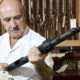 Old man holding a gun | Gun Store Owners Talk About Increase in Business during Pandemic | Featured