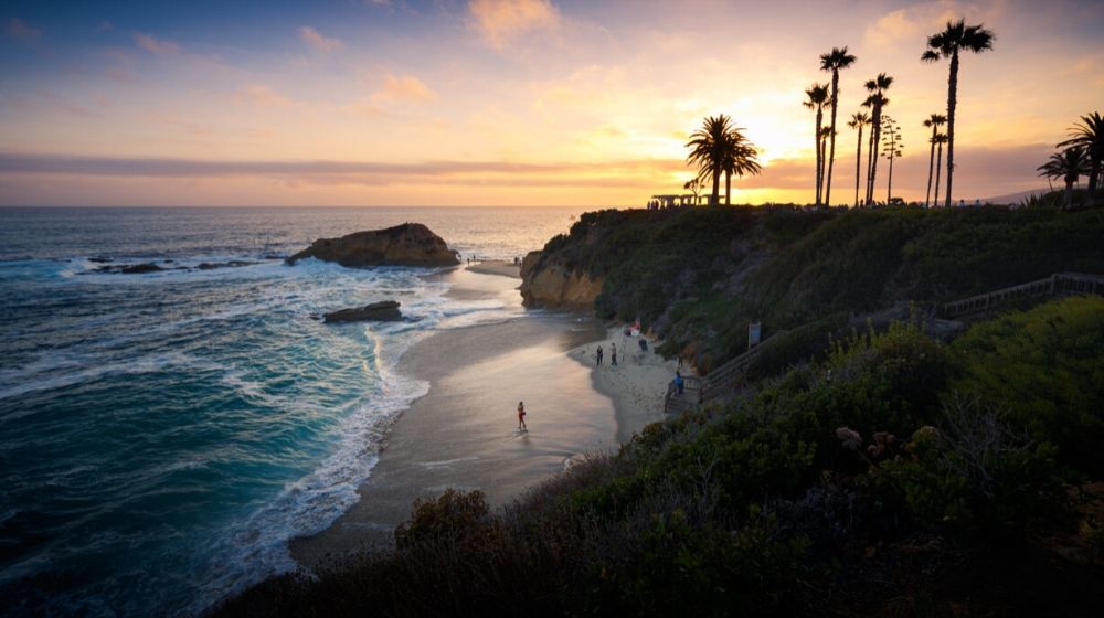 Laguna Beach during sunset | New Study Forecasts That Half of the World’s Beaches Will Disappear by 2100 If Climate Change Persists | Featured