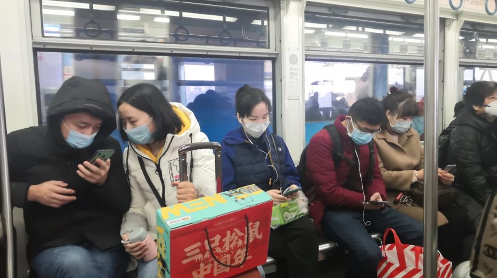 chinese passenger inside a train | Chinese Officials Suggest That U.S. Army Brought the Coronavirus to Wuhan | Featured