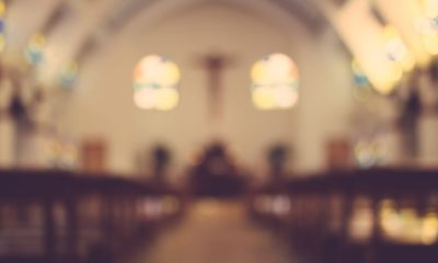blurred photo of a church | Church Members Outraged as Registered Sex Offender Returns to Preach | Featured
