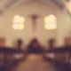 blurred photo of a church | Church Members Outraged as Registered Sex Offender Returns to Preach | Featured
