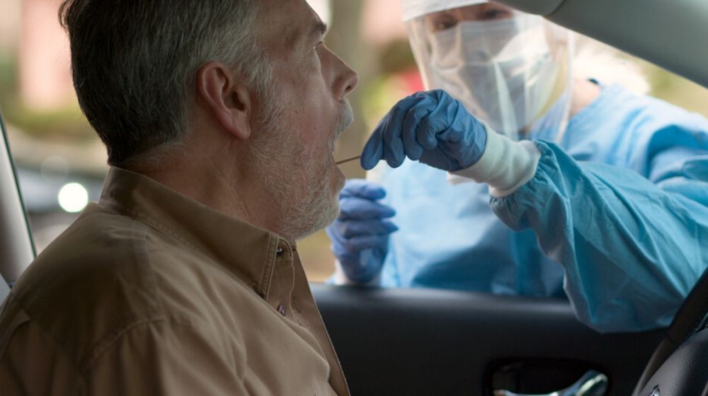 man having swab test for coronavirus | 1.67 Million Tested for Coronavirus in US, says Donald Trump | Featured