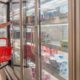 Woman the frozen good section in the grocery | Demand for Frozen Food Rises Amid Coronavirus Pandemic | Featured