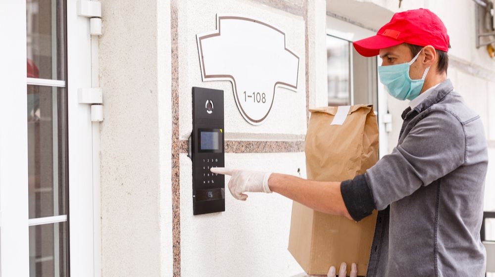 Courier sending delivery | CDC Releases New Guidelines for Essential Workers | Featured