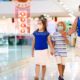 Mother and her two daughter inside a mall | Simon Property Group Plans to Reopen 49 Malls Amid Pandemic | Featured