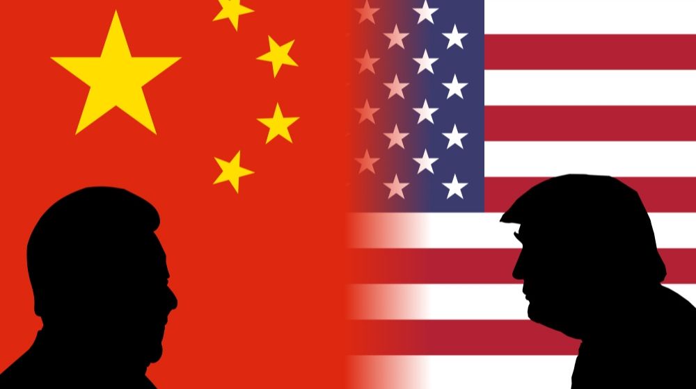 Flag of China and United states with their President's silhouette | Dr. Fauci: China Delayed our Understanding of COVID-19's Efficient Transmissibility | Featured