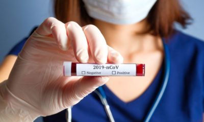 Nurse holding a test tube with blood for covid testing | Containment Efforts Show Progress as Coronavirus Curve Begin to Flatten | Featured
