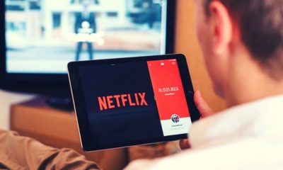 Man watching Netflix | Netflix Reports 15.7 Million Global Subscriber Additions as People Around the World Stay at Home | Featured