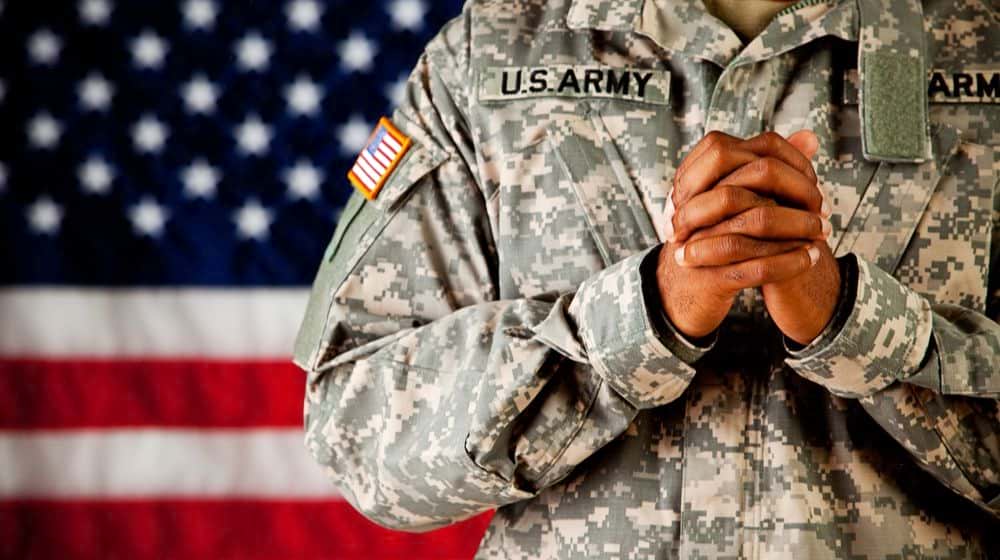A US soldier praying | MRRF Complains About Army Chaplains’ Prayer Videos on Facebook; Claims They Amount to “Illicit Proselytizing” of Christianity | Featured