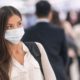 Asian woman traveling wearing a mask | Laredo, Texas Requires Residents to Wear Masks or Pay $1,000 Fine | Featured
