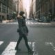 woman crossing a street | Study Suggests Millions of New Yorkers Infected | Featured