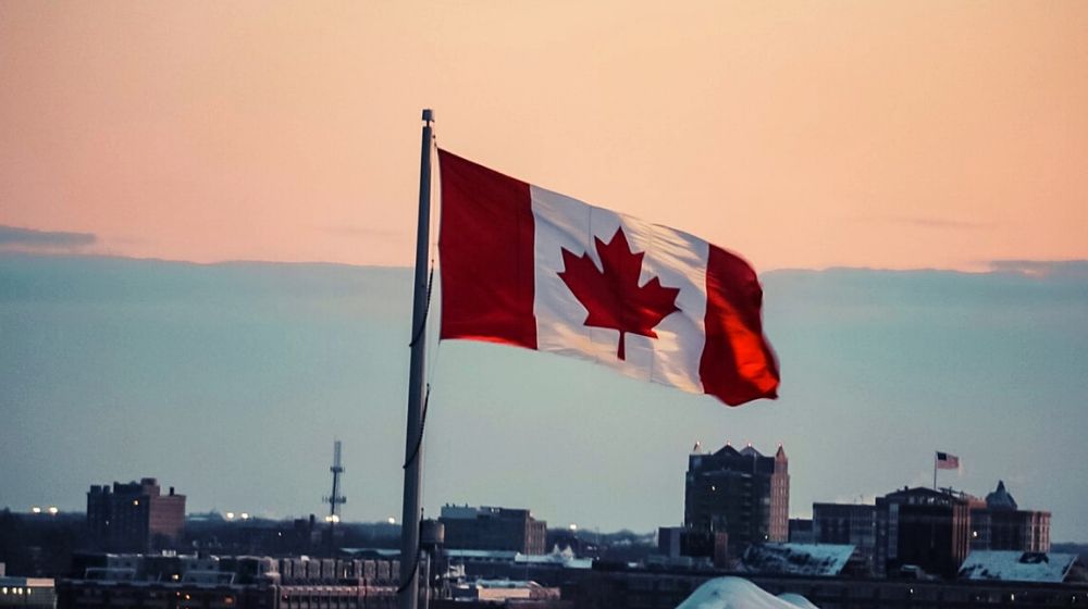 Flag of Canada | Canada to Resist Re-Opening Border to U.S. | Featured