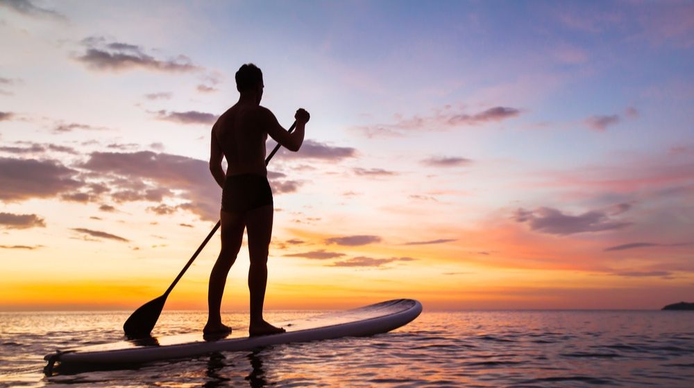 Man on a paddleboard | Southern California Paddleboarder Arrested for Violating ‘Safer at Home’ Order | Featured
