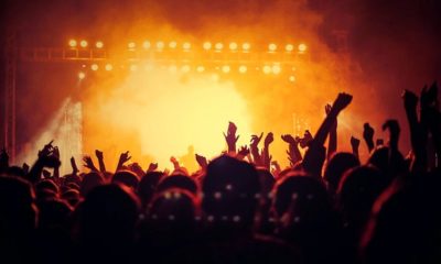 People enjoying a concnert | Live Nation to Launch a Refund Program for Canceled and Rescheduled Shows Caused by COVID Pandemic | Featured
