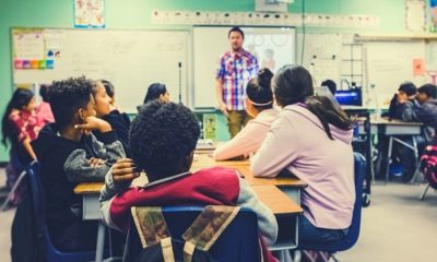 student listening to their teacher | Trump Claims 'Total' Authority, Over Governors, to Reopen Economy | Featured