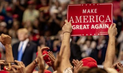 A Fan Holds Up a "Make America Great Again" Sign While President Donald J. Trump Delivering a Speech | Everything You Need to Know About President Trump's Rally In Tulsa | Featured