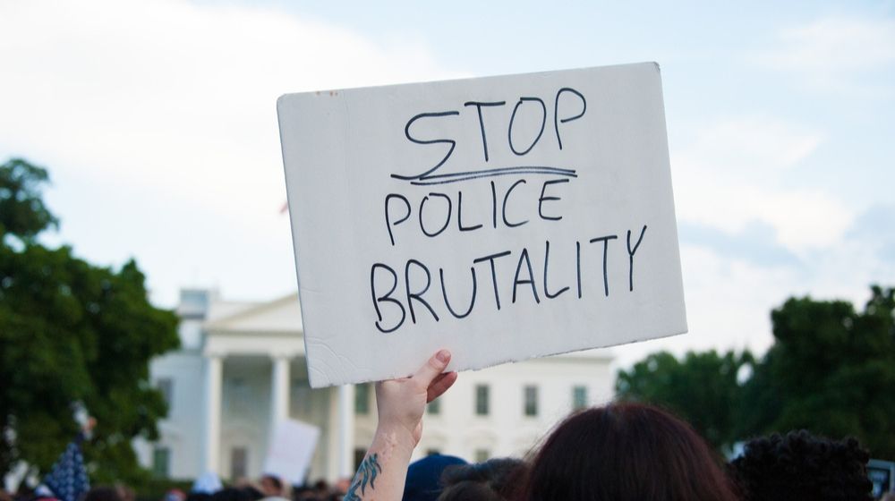 Stop Police Brutality Protest Sign | GOP Proposals Seek to Curb Police Brutality | Featured