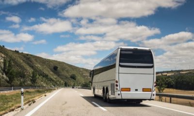Long Haul Bus for Tourists Drives through the Open Roads | While Other Businesses Reopen, Tour Bus Industry Continues to Suffer | Featured