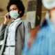 African American Woman Wearing Face Mask | Virus Flare-Ups Threaten to Derail Reopening Efforts | Featured