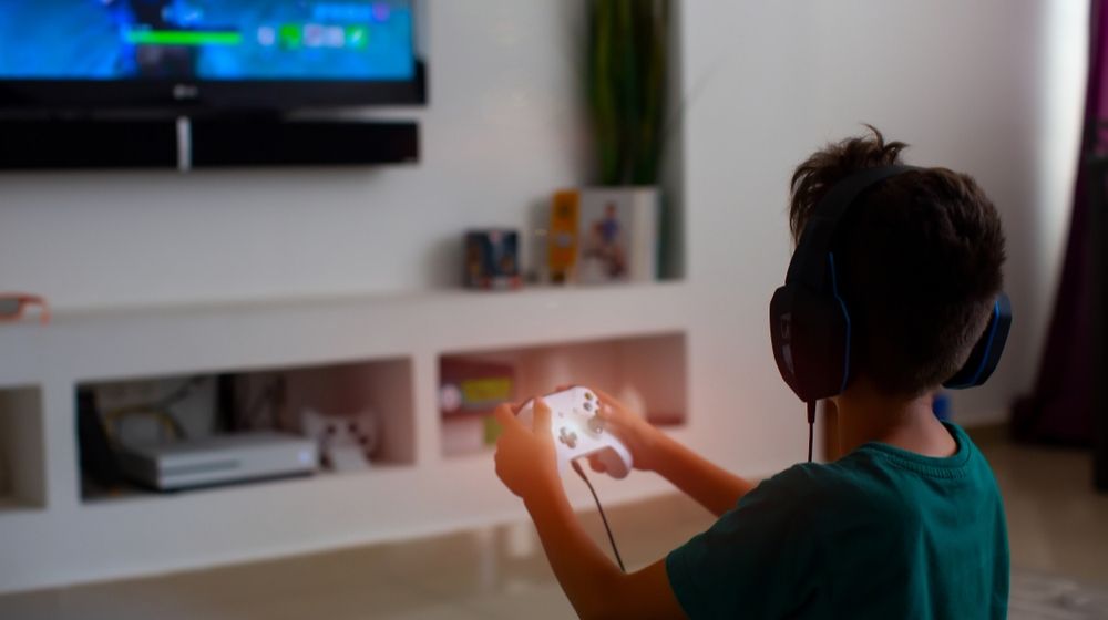 Back View of Concentrated Young Gamer Playing Game | FDA Approves Video Game Designed for Children with Certain ADHD Symptoms | Featured
