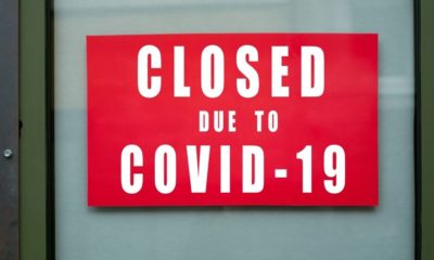 Closeup of Information Sign on The Metallic Window of The Store Front | COVID-19 Pandemic Extremely Affected Black Business Owners | Featured