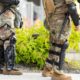 Faceless National Guard soldiers wearing body riot gear | Trump Orders Withdrawal of National Guard from Washington | Featured