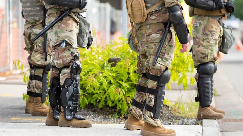 Faceless National Guard soldiers wearing body riot gear | Trump Orders Withdrawal of National Guard from Washington | Featured
