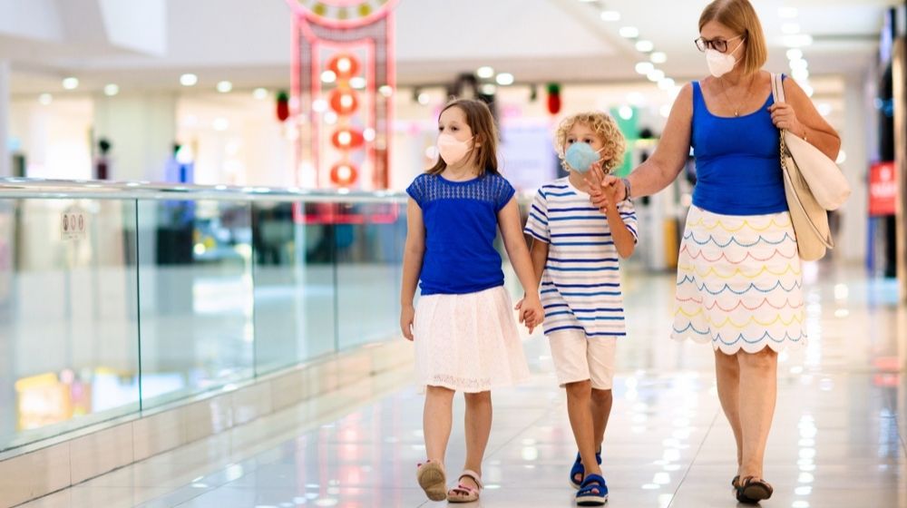 Family Wearing Face Mask in Shopping Mall | Lawsuit Challenges Florida County's Mask Mandate | Featured
