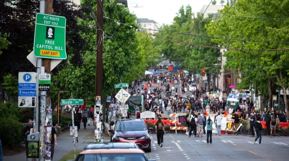 "Free Capitol Hill. Last Exit" Highway Sign Above the Capitol Hill Autonomous Zone (CHAZ) | It Took Two Shootings and a Murder to Convince Seattle Liberals to Address 'Autonomous Zone' | Featured