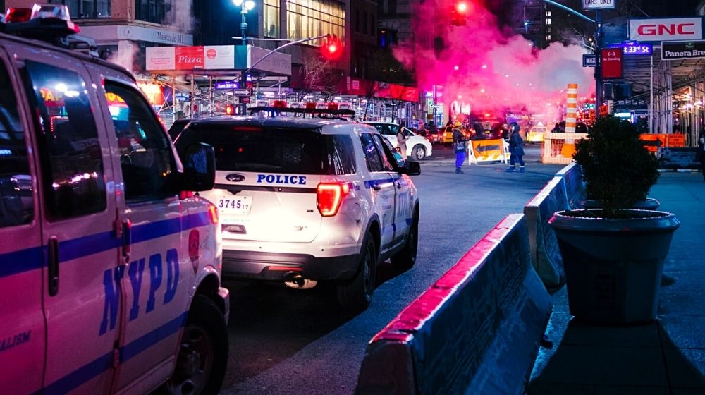 NYPD Police car and van at night | Looters and Rioters in New York Get Immediate Release Following New Bail Reform Law | Featured
