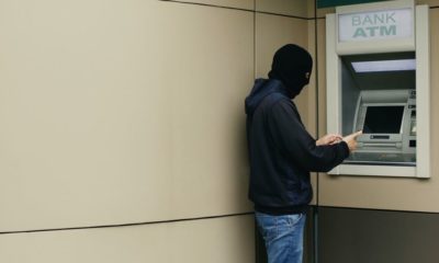 Thief with Black Balaclava in Front of ATM Machine | Man Dies After Attempting to Break into an ATM Using Explosives | Featured